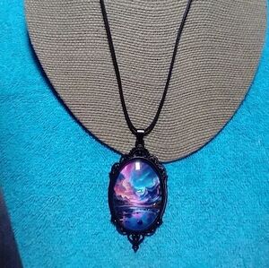Black cabochon on black cord pink blue aurora mountain scene necklace